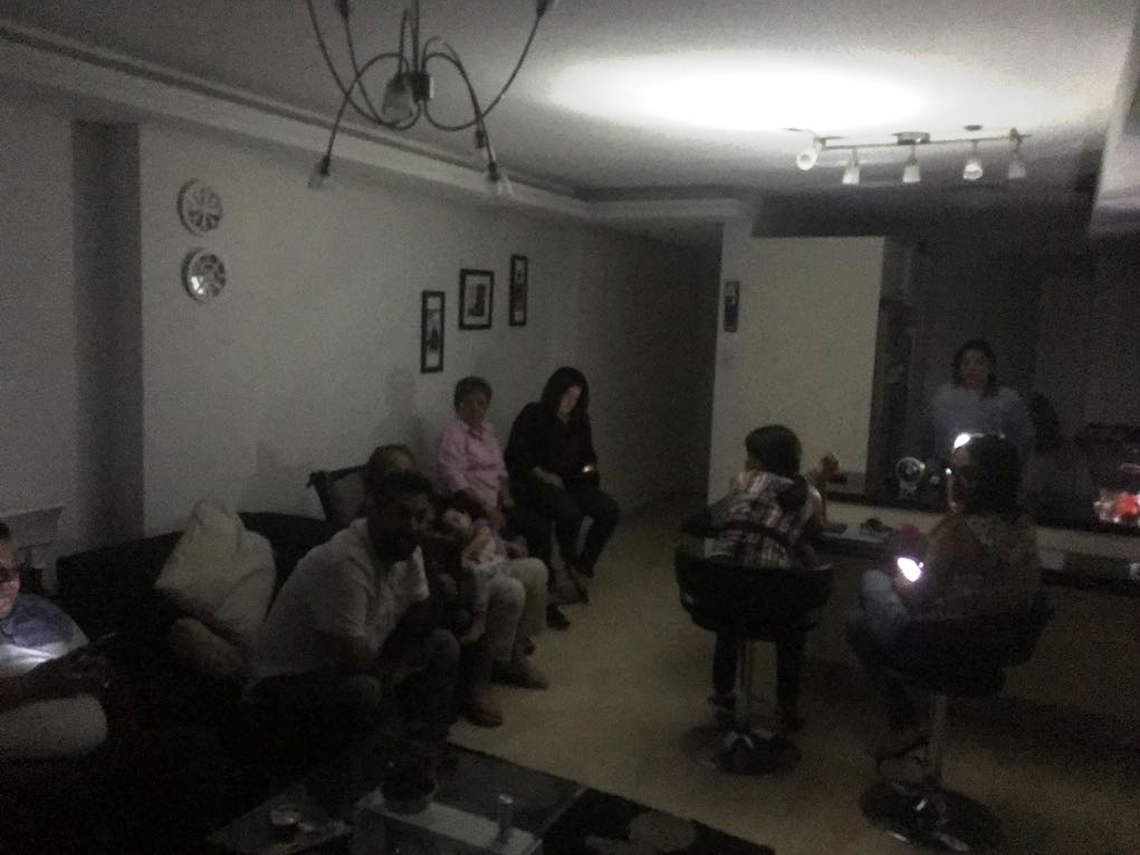 The Ocando family in their home in Maracaibo, Venezuela’s second largest city, during a power outage. The outages have become so frequent in the past year that people routinely use candles to see at night and freeze water bottles in their refrigerators to keep food from spoiling.