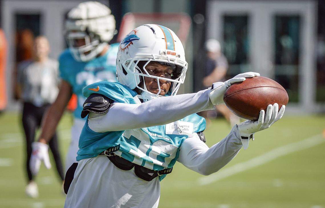 Miami Dolphins cornerback Mike Hilton (38) catches a pass during drills.