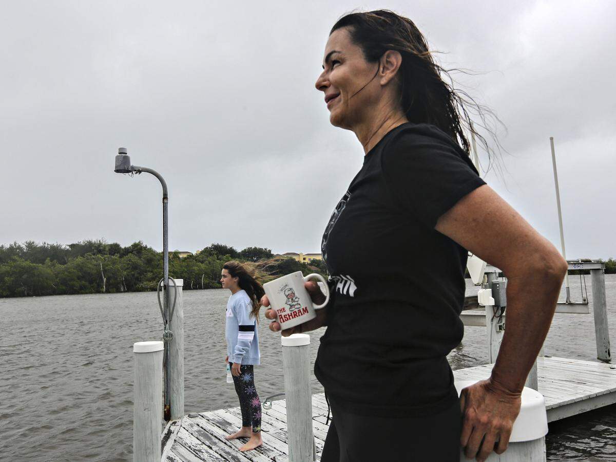Palm Beach socialite and former model, Margaret Luce, right, and her family have been trying to deal with the anxiety over Hurricane Dorian for the last several days. Margaret takes a quick walk outside with her daughter, Claire, during the long wait for the latest news on the storm’s path as it moved slowly on a northern track about 100 miles off of Palm Beach, Florida on Tuesday, September 3, 2019.