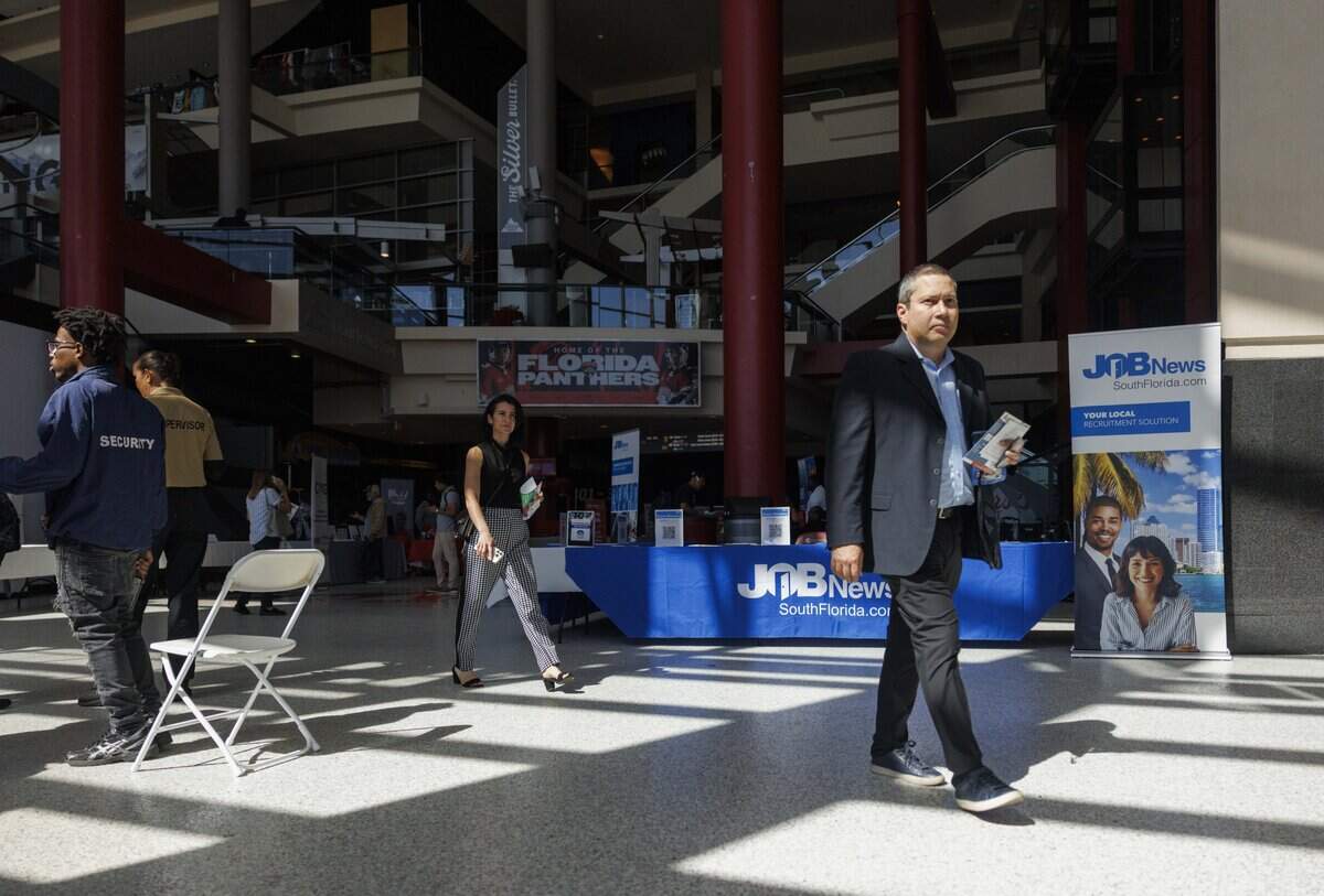 People attend the Job News South Florida Job Fair on Thursday, Oct. 30, 2025, at Amerant Bank Arena in Sunrise, Fla.