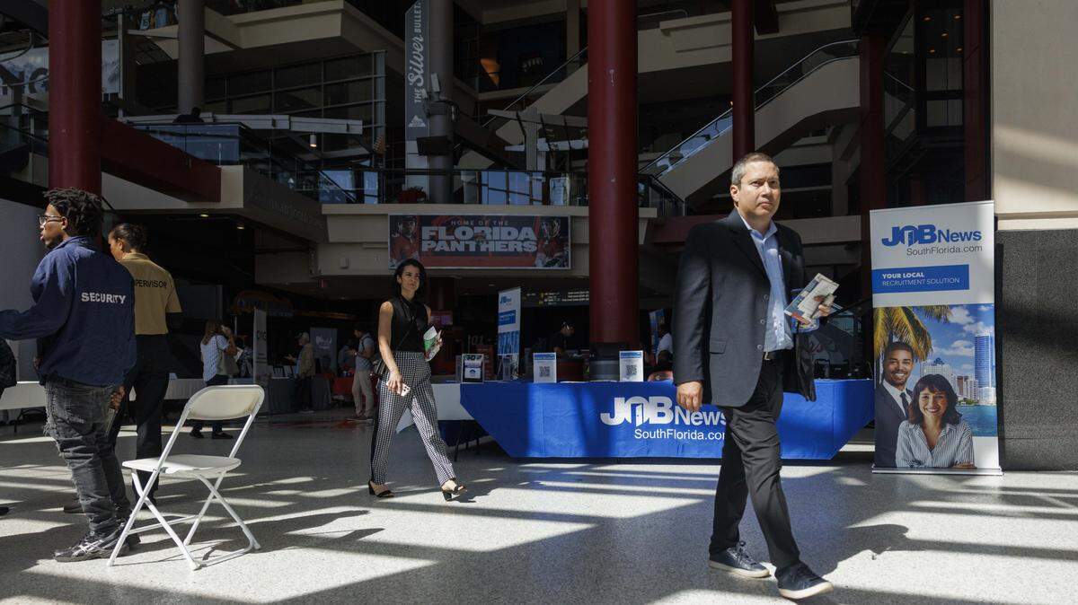 People attend the Job News South Florida Job Fair on Thursday, Oct. 30, 2025, at Amerant Bank Arena in Sunrise, Fla.