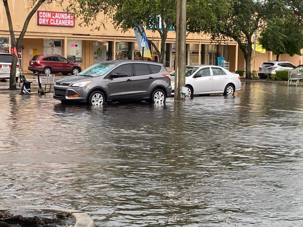 The parking lot of a Winn-Dixie in Hallandale Beach flooded in the afternoon of Thursday, June 9, 2022.