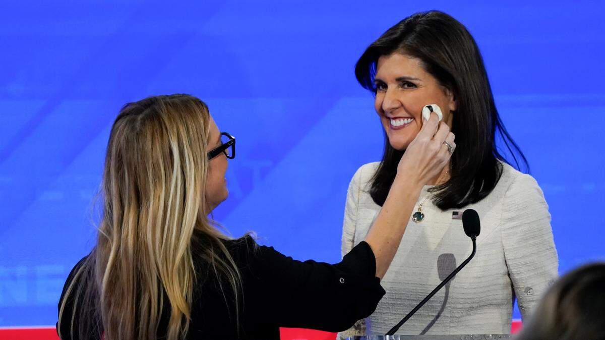 Former South Carolina Gov. Nikki Haley gets a makeup touch-up during a break in the fourth Republican presidential primary debate at the University of Alabama.