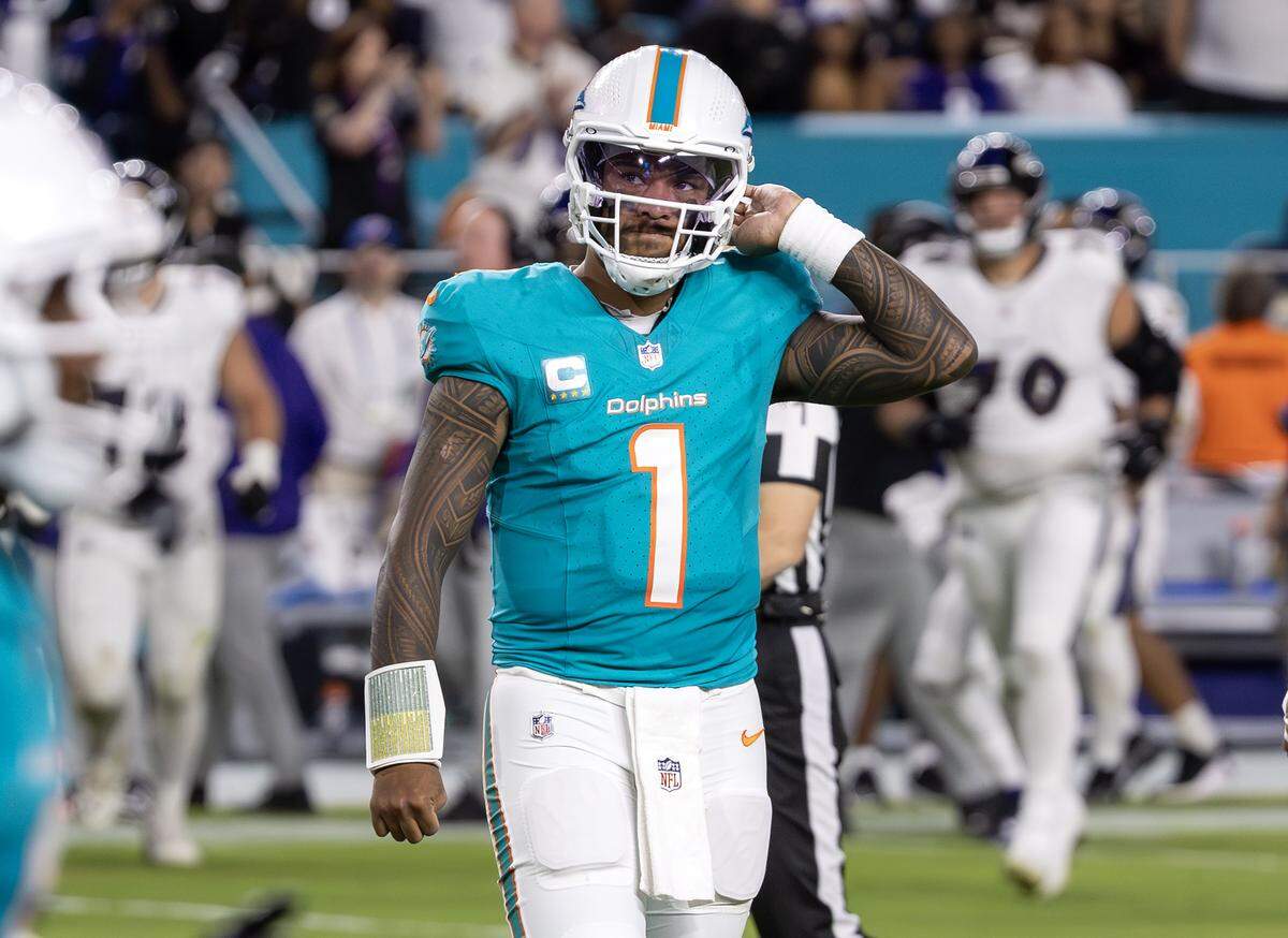 Miami Dolphins quarterback Tua Tagovailoa (1) reacts after a fourth down during the first half of an NFL game against the New York Jets at Hard Rock Stadium on Thursday, Oct. 30, 2025, in Miami Gardens, Fla.