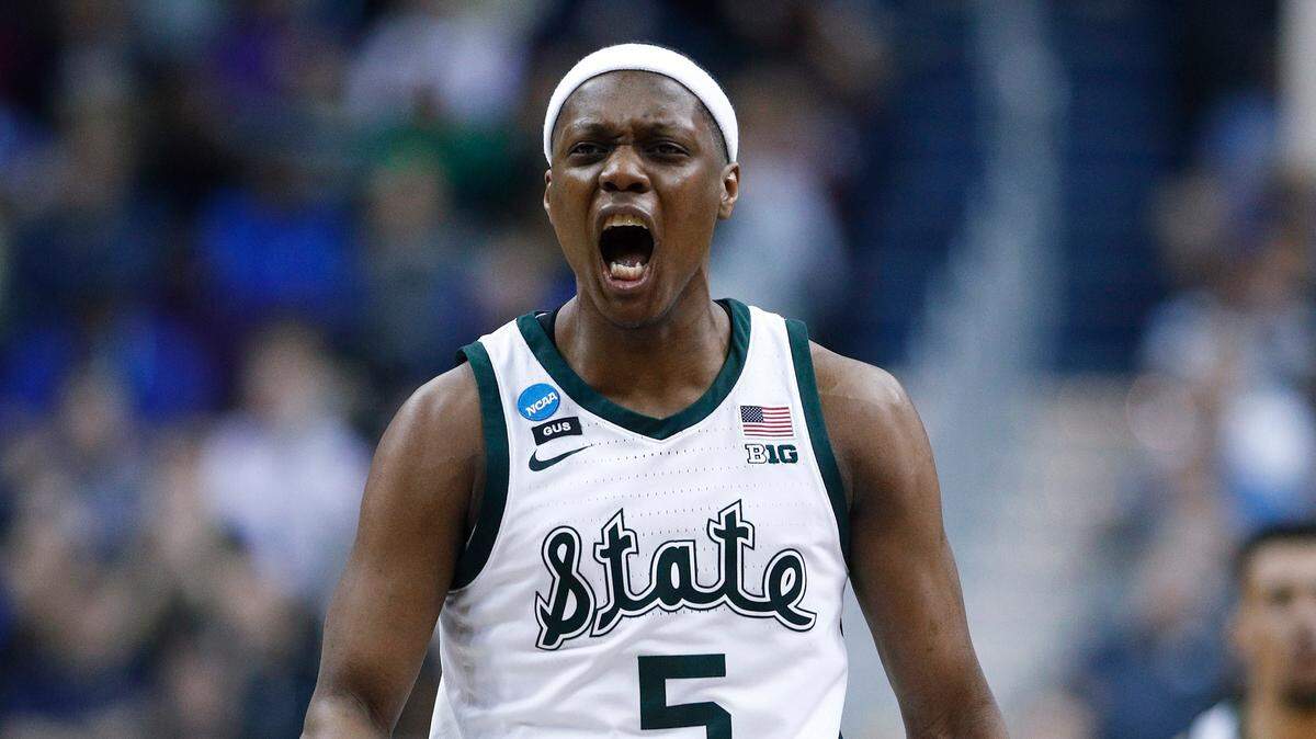 Michigan State guard Cassius Winston reacts to scoring on LSU during the first half of an East Regional semifinal in the NCAA men’s college basketball tournament in Washington, Friday, March 29, 2019.