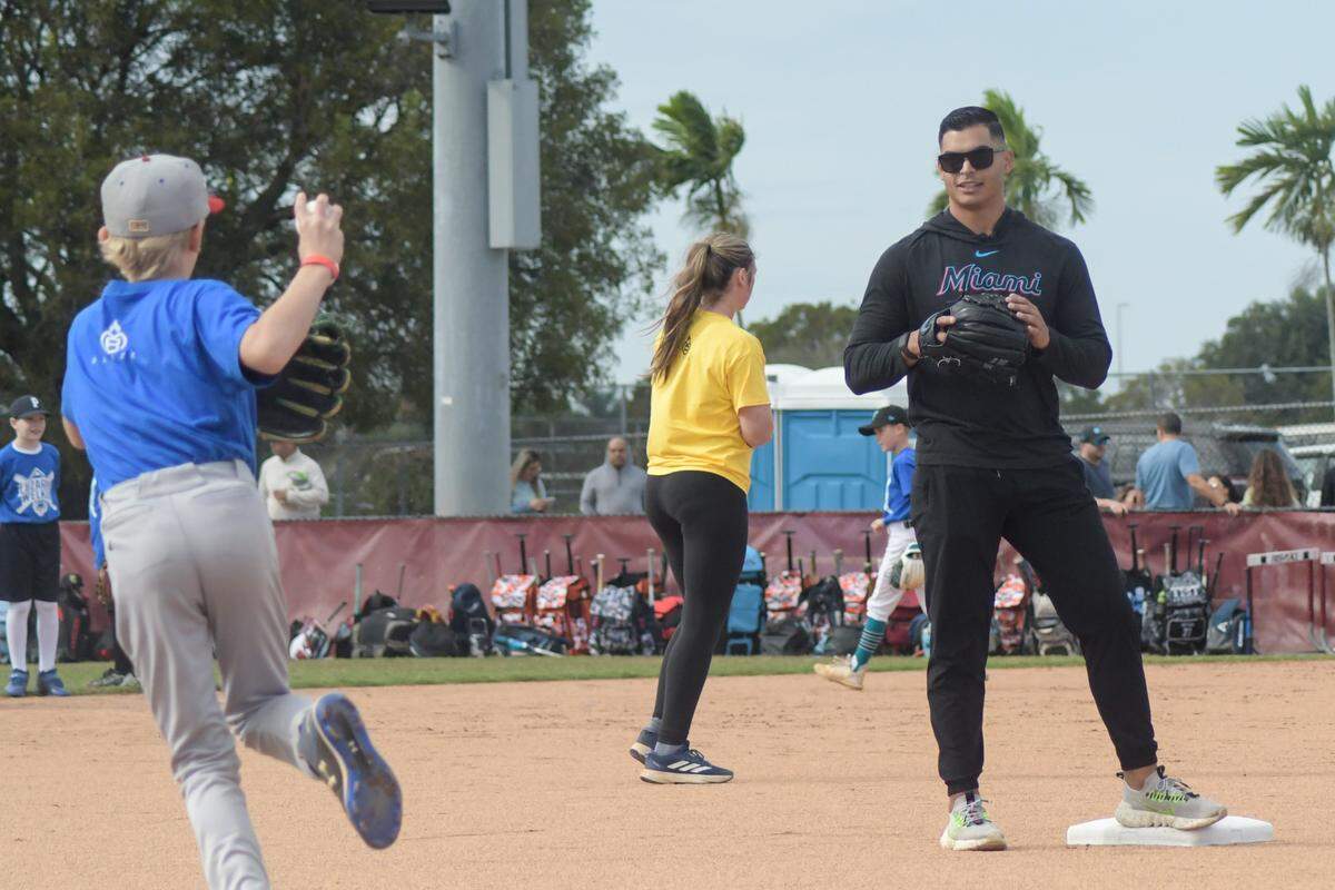 Miami Marlins pitcher Jesus Luzardo helps run drills during a baseball clinic at Stoneman Douglas High in Parkland, Florida, on Saturday, Jan. 20, 2024. Luzardo and high school teammate Colton Welker, both Stoneman Douglas alums, have held a baseball clinic at the school together for the past four years.