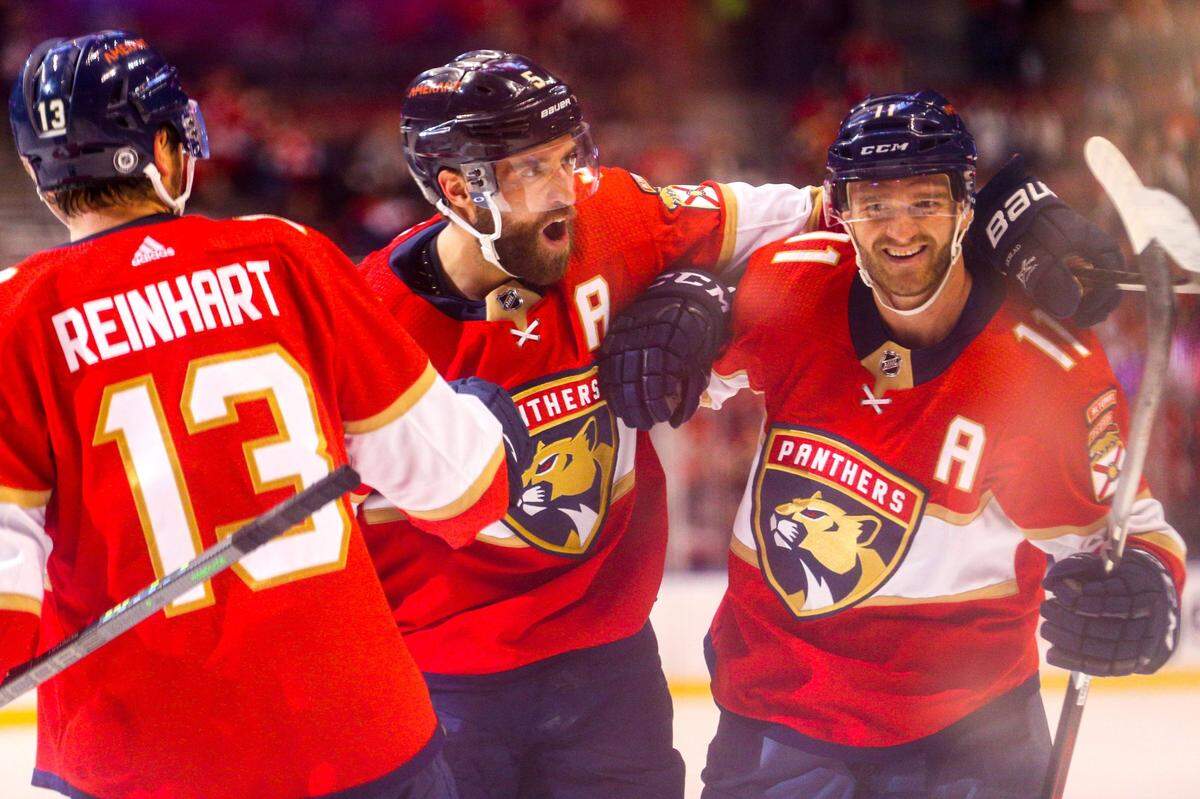 Florida Panthers players react after center Jonathan Huberdeau (11) scored on Vancouver Canucks goalie Thatcher Demko (35) during the second period of an NHL game at FLA Live Arena in Sunrise, Florida, on Tuesday, January 11, 2022.