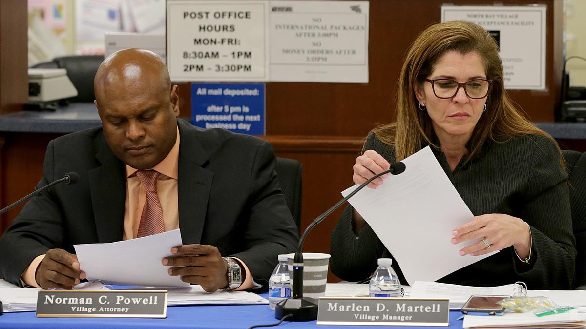 North Bay Village City Attorney Norman C. Powell, left, and Village Manager Marlen D. Martell during a commission meeting at the North Bay Village City Hall on Tuesday, May 8, 2018.
