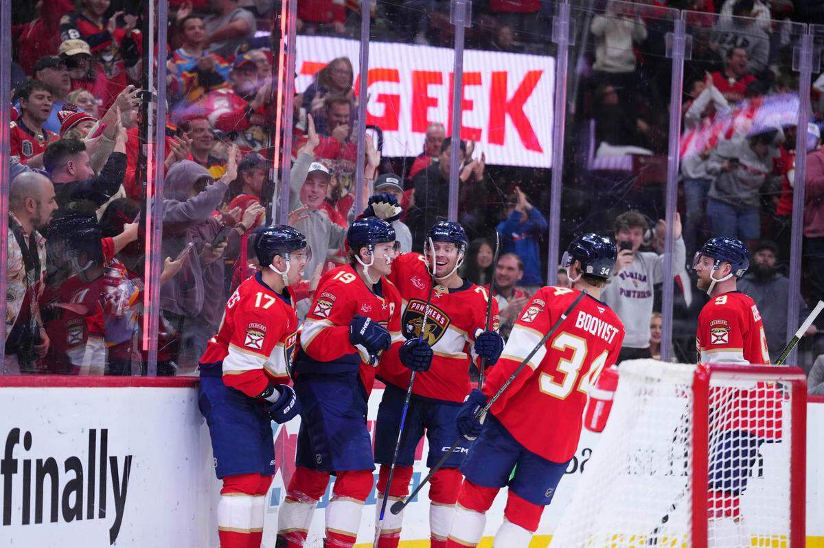 Jan 3, 2025; Sunrise, Florida, USA; Florida Panthers left wing Matthew Tkachuk (19) celebrates with teammates after scoring against the Pittsburgh Penguins during the third period at Amerant Bank Arena.