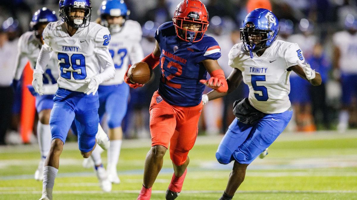 Champagnat’s Kevin Blount (12) makes his way towards the end zone for a touchdown. Trinity Christian leads Champagnat 14-7 at the half of the Class 2A State Championship game at Gene Cox on Thursday, Dec. 9, 2021.
