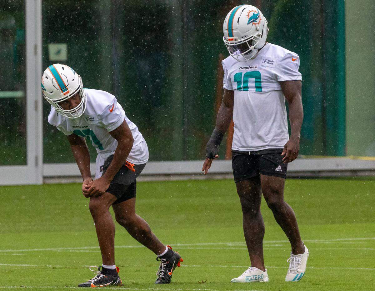 Miami Dolphins wide receivers Tyreek Hill (10) and Jaylen Waddle (17)  run drills during Organized Team Activities at the Baptist Health Training Complex on Tuesday, June 3, 2025, in Miami Gardens, Fla.