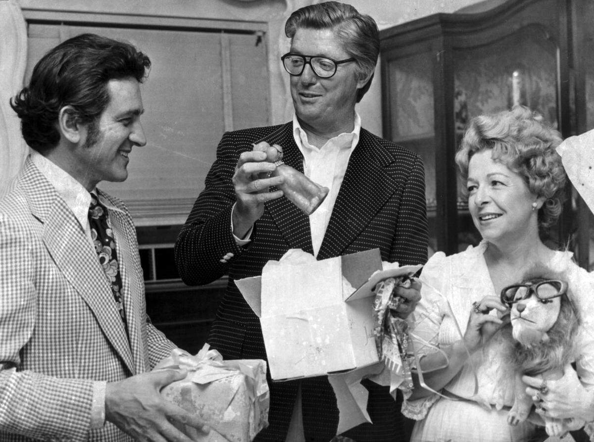 Ralph Renick, center.