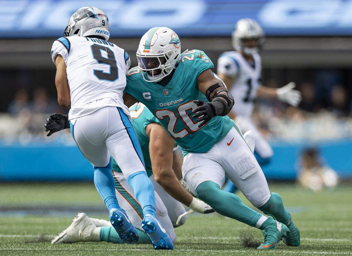 Miami Dolphins linebacker Jordyn Brooks (20) sacks Carolina Panthers quarterback Bryce Young (9) in first half of their NFL game at the Bank of America Stadium on Sunday, Oct. 5, 2025, in Charlotte, N.C.