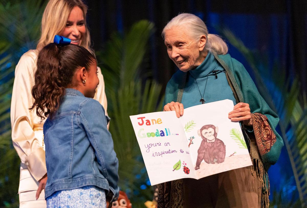 Gabriela Espinosa, left, presents a hand written letter to Dr. Jane Goodall at the conclusion of ‘An Evening With Jane Goodall: Inspiring Hope Through Action’ at Florida International University’s Ocean Bank Convocation Center on Friday, March 31, 2023, in Miami, Fla.