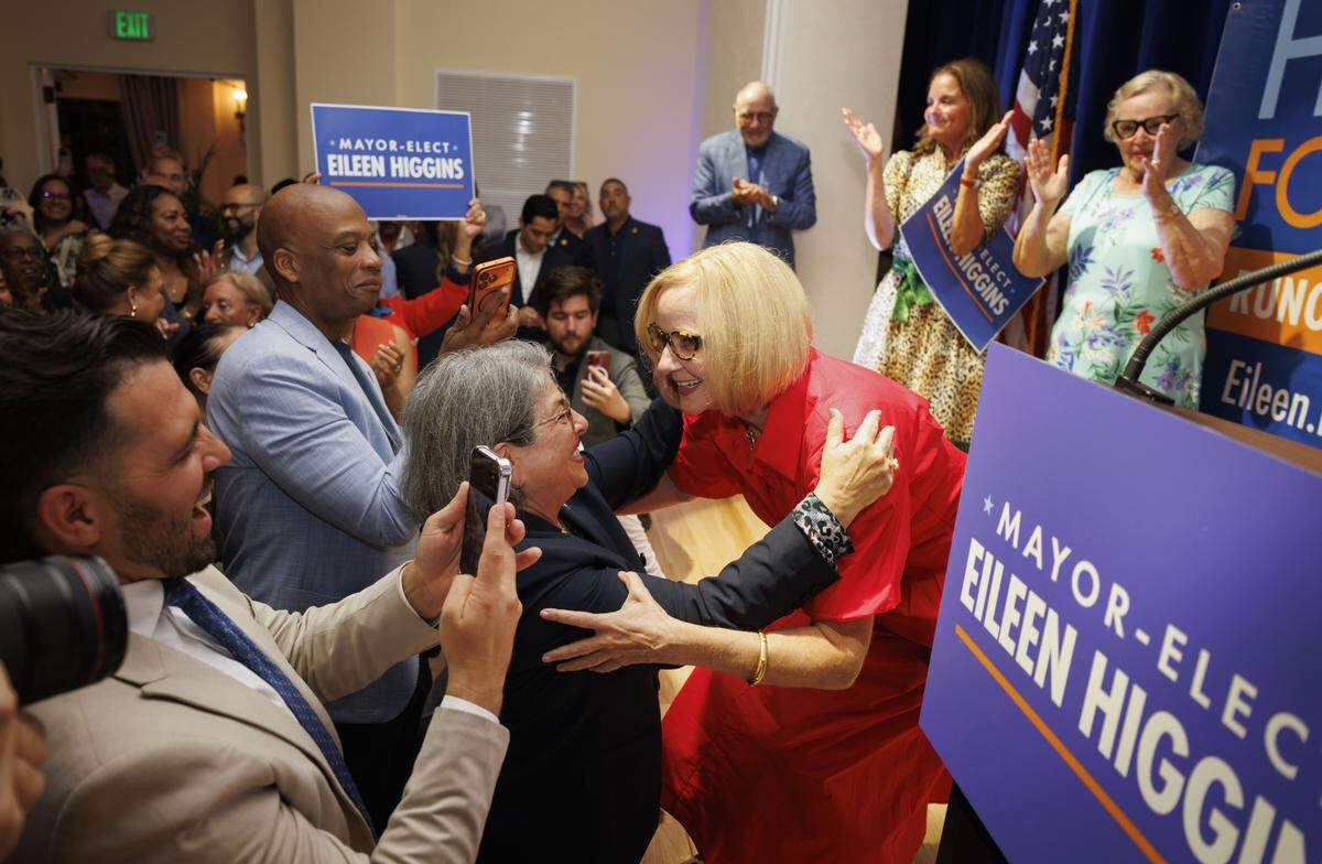 Mayor-elect Eileen Higgins, former Miami-Dade County Commissioner, right, reacts with Miami-Dade Mayor Daniella Levine Cava, center, and Commissioner Oliver Gilbert, second from the left, after an apparent victory during an election night watch party in the runoff race for Miami mayor on Tuesday, Dec. 9, 2025, at the Miami Women's Club in Miami, Fla. 