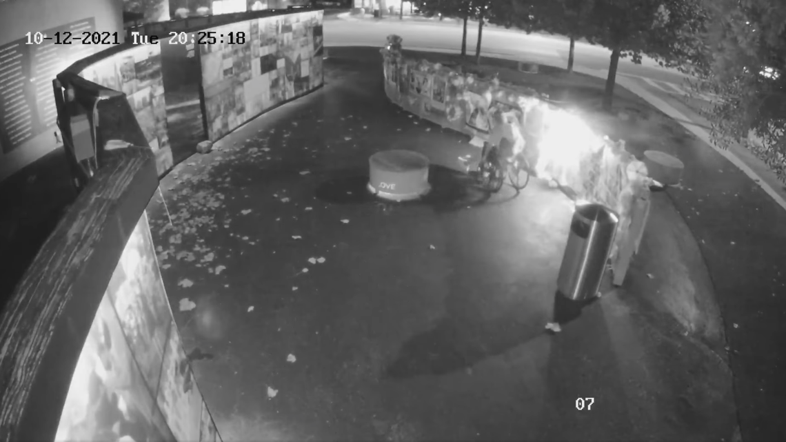 Surveillance cameras recorded a man starting a fire at the temporary memorial that is set up outside of Pulse nightclub in Orlando.