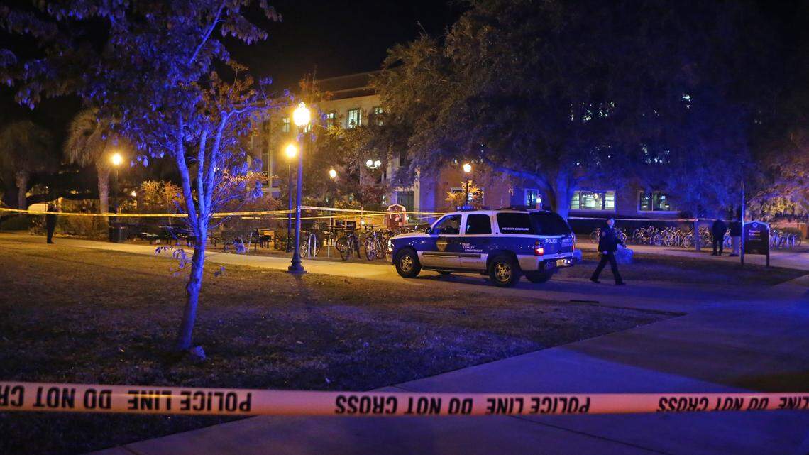 Police investigate a shooting at Strozier Library on the Florida State University campus on Thursday, Nov. 20, 2014, in Tallahassee. Three people were wounded and the shooter was killed.