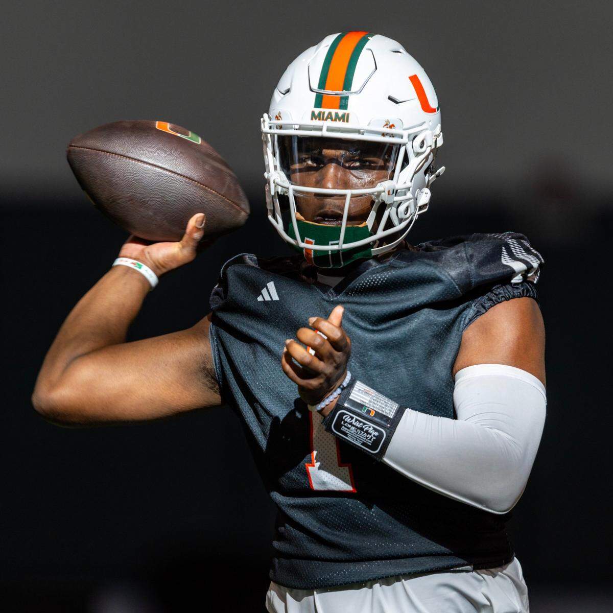 Miami Hurricanes quarterback Cam Ward (1) throws the ball during practice at the Carol Soffer Indoor Practice Facility on Wednesday, July 31, 2024, in Coral Gables, Fla.