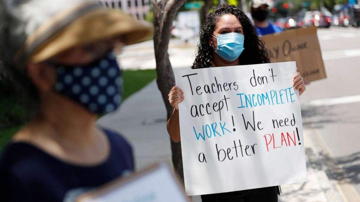 First-grade teacher Yolanda Vasquez protests along with other teachers and counselors in front of the Hillsborough County Schools District Office in Tampa, Florida.