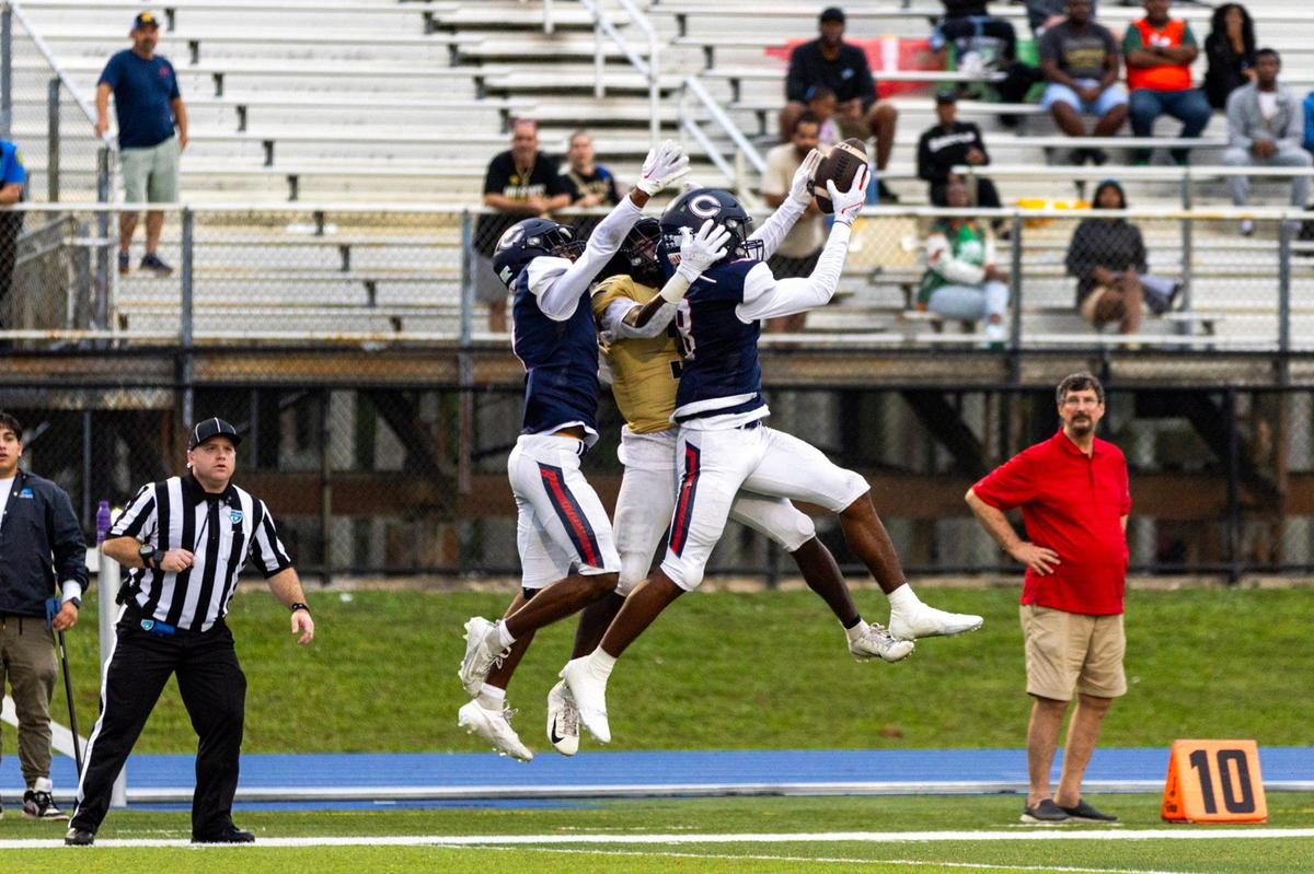 Columbus free safety Bryce Fitzgerald (8) intercepts the ball intended for Western wide reciever Alonzo Carter (3) during the Region 4-4M final at Tropical Park in Miami, Florida, on Friday, November 24, 2023.