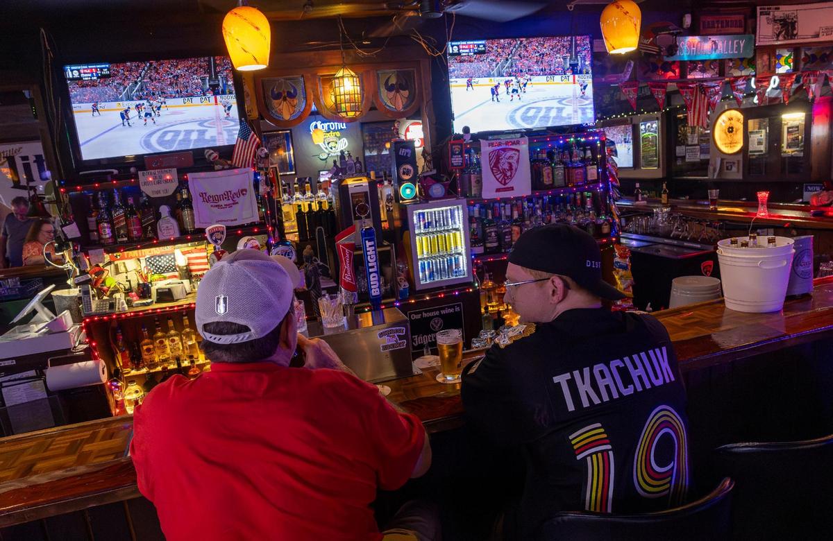 Florida Panthers fan watch Game 2 of the NHL Stanley Cup Final against the Edmonton Oilers at the Inn Field Bar & Grill on Friday, June 6, 2025, in Sunrise, Fla.
