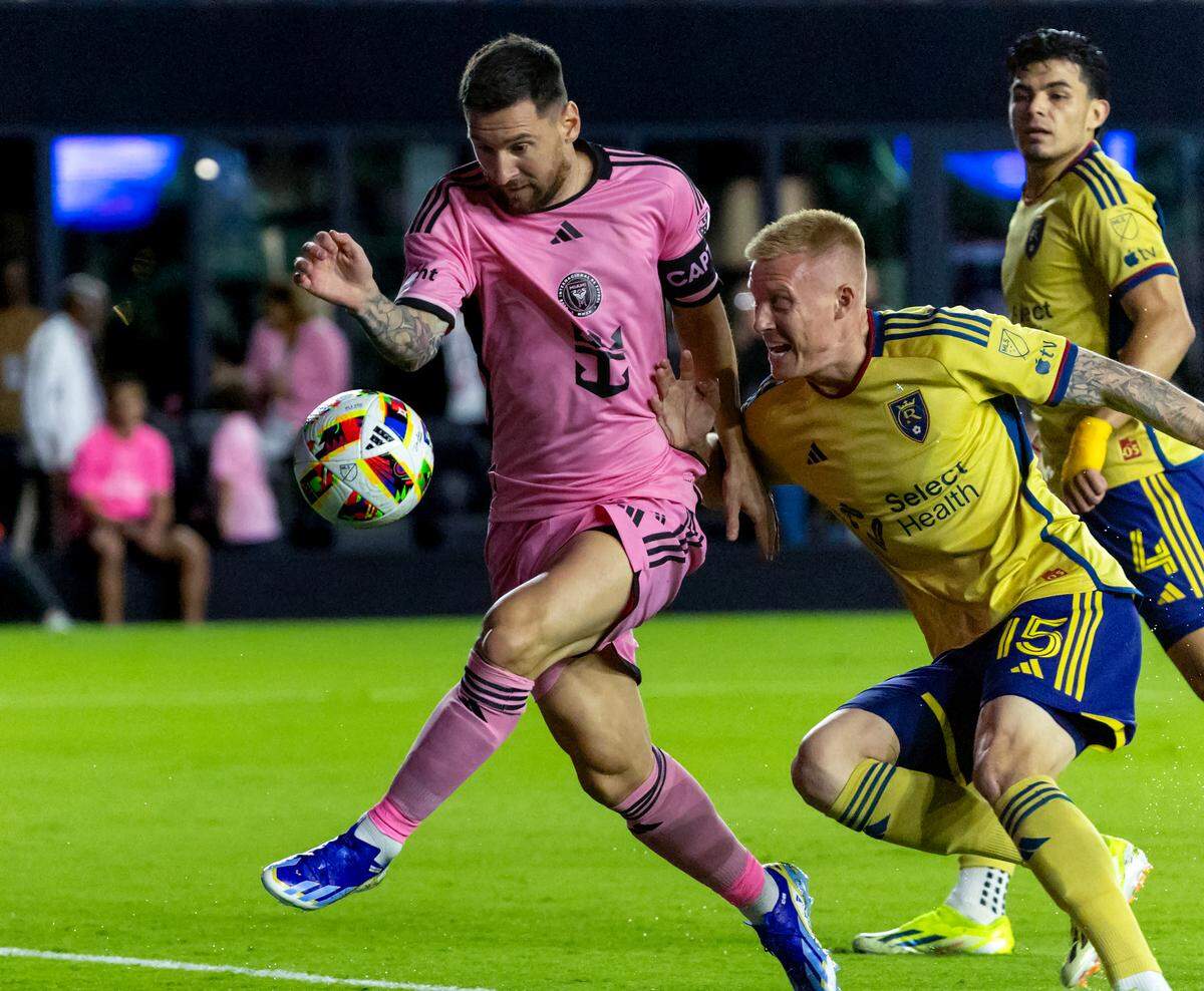 Inter Miami forward Lionel Messi (10) attempts a shot on the goal as Real Salt Lake defender Justen Glad (15) defends in the first half of an MLS match at Chase Stadium on Wednesday, Feb. 21, 2024, in Fort Lauderdale, Fla.