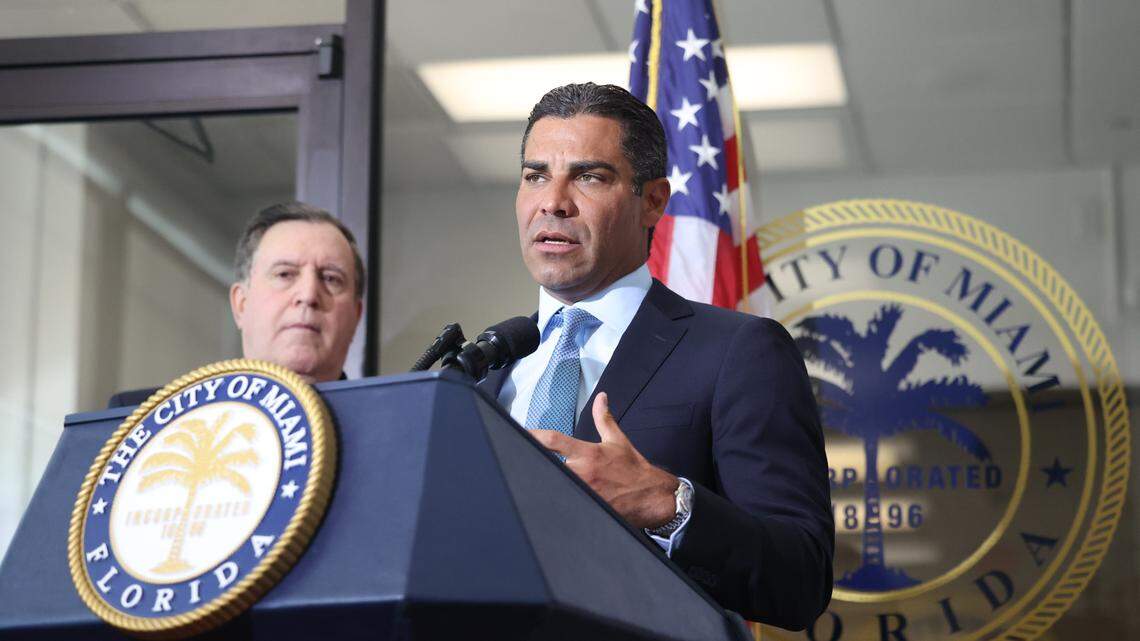 Miami Mayor Francis Suarez, right, speaks during a press conference held with Commissioner Joe Carollo to announce a pause on the plans for homeless housing in Virginia Key on Monday, Aug. 8, 2022, at Miami City Hall.