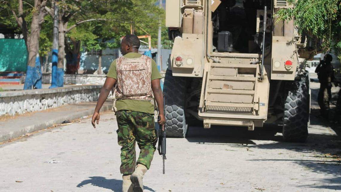 In this photo from December 2024, teams from the Haiti National Police and the Kenya-led Multinational Security Support mission advance into areas controlled by gangs in Haiti.