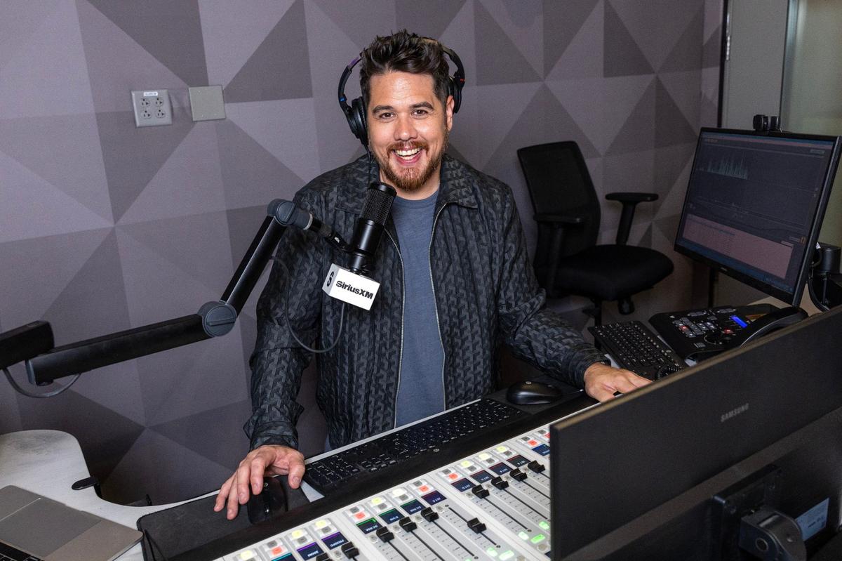 Michael ‘Mack’ Weaver speaks to callers during a broadcast at SiriusXM Studio on Wednesday, July 17, 2024, in Miami, Fla.