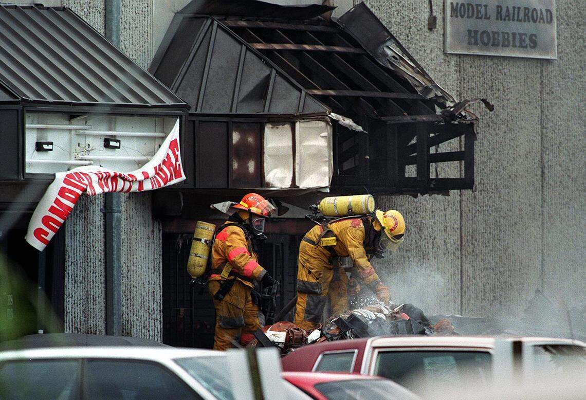 The wreckage of a Fine Air DC-8 cargo plane lies against buildings on NW 72nd Ave west of Miami International Airport.