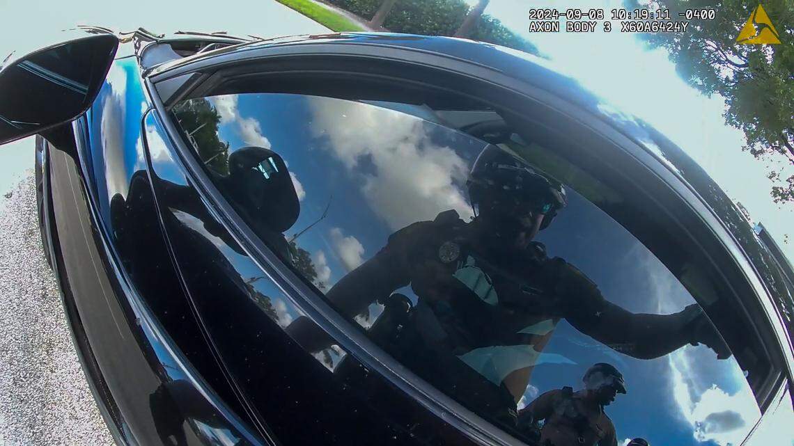 The dark tinted windows on Tyreek Hill’s McLaren 720S appeared to be darker than the law permits, some legal experts said. Photo capture of Miami-Dade Police body-camera footage from Hill’s traffic stop on Sunday, Sept. 8, 2024, by Hard Rock Stadium.