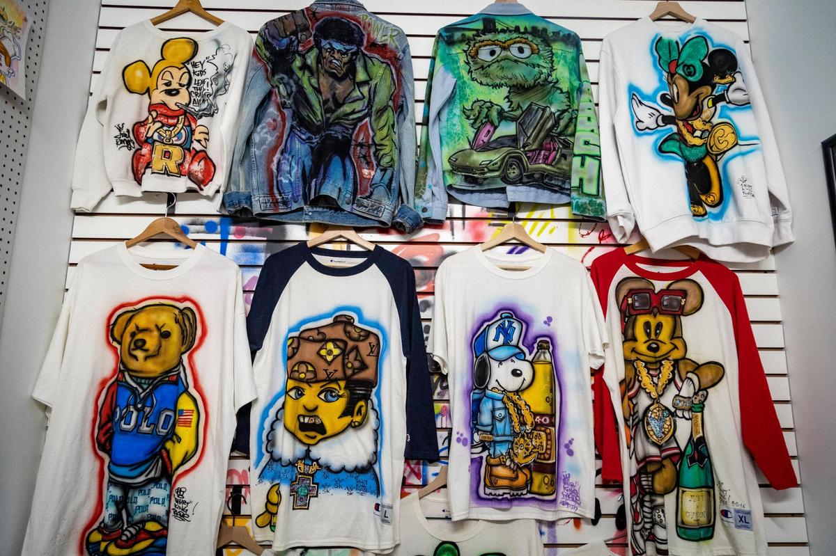 Some graffiti artists turned to merchandise to make money. The museum pays tribute with a recreation of The Shirt King store at the Coliseum Mall in Queens.