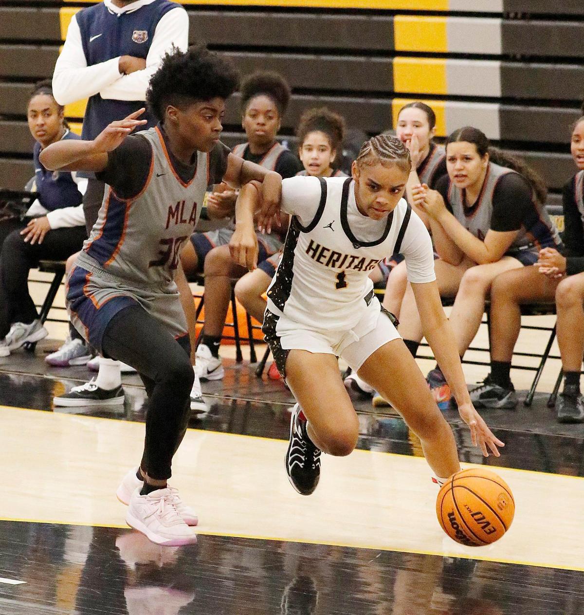American Heritage Patriots Ta’Niyah Davis (1) dribbles against Mater Lakes Academy Bears during 2025 FHSAA Region 4A District 15 Girls Basketball final game on Friday, February 21, 2025 at American Heritage HS in Plantation. Andrew Uloza / for Miami Herald