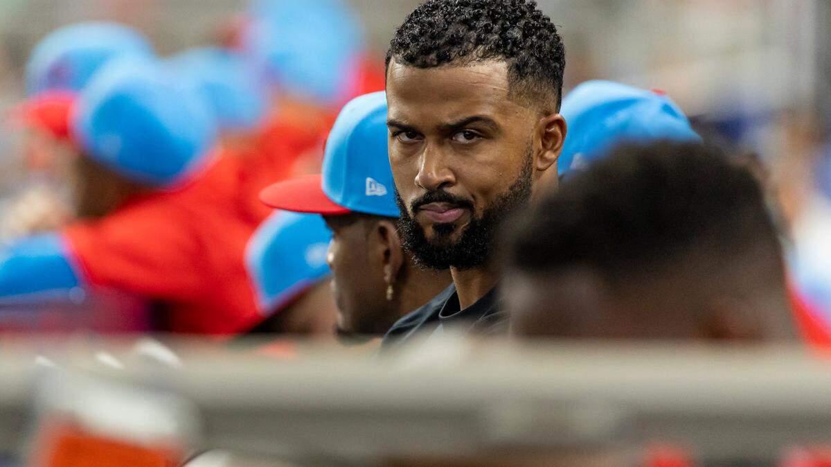 Miami Marlins pitcher Sandy Alcantara (22) looks on from the dugout as his team plays against the Milwaukee Brewers in the first inning of an MLB game at loanDepot park on Saturday, Sept. 23, 2023, in Miami, Fla.