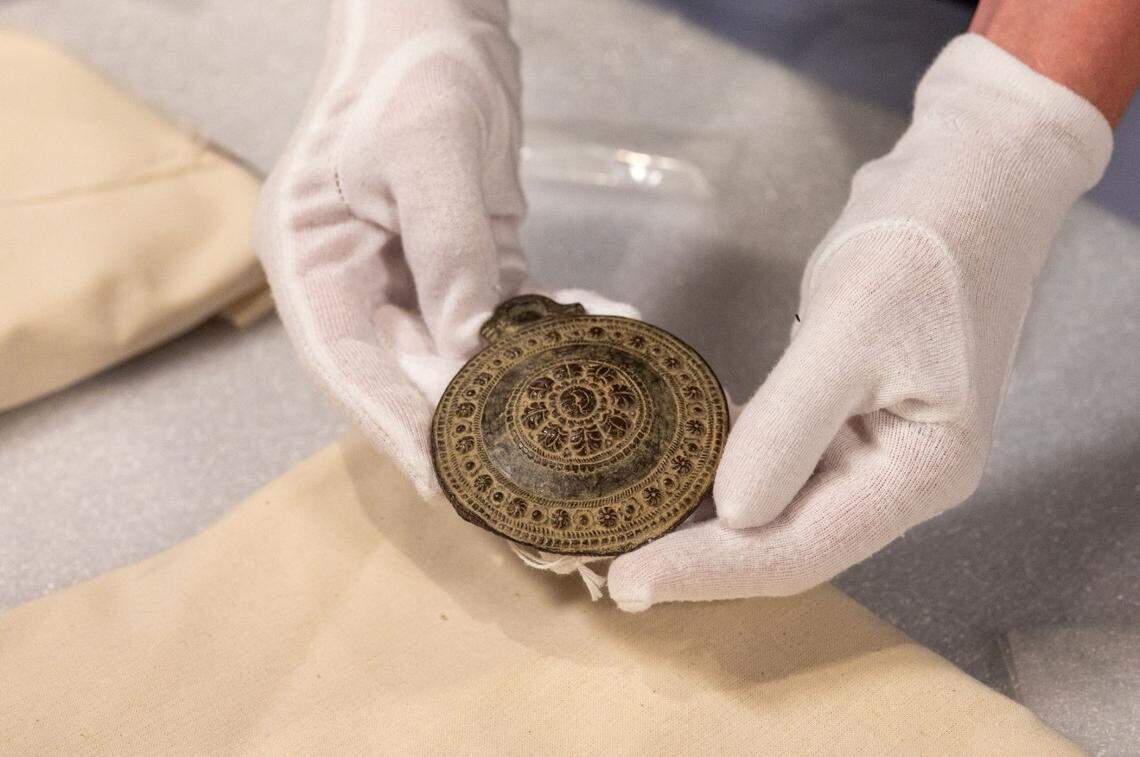 Two medallions and eight rings found at a thrift store may turn out to medieval artifacts.