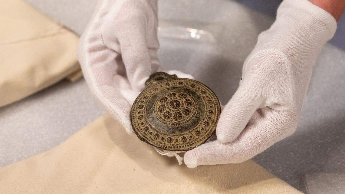 Two medallions and eight rings found at a thrift store may turn out to medieval artifacts.