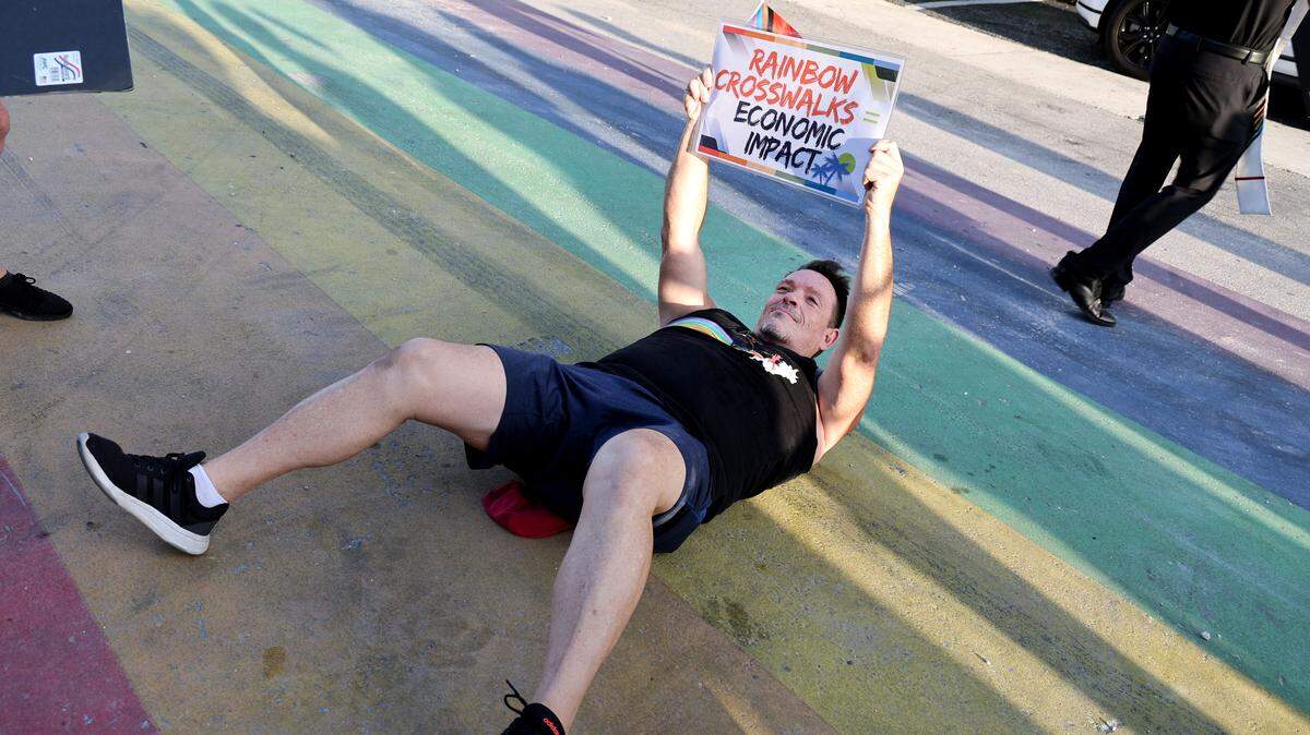 Kevin O’Connell of Lauderhill joins a protest at the Rainbow Crosswalk along Sebastian Street and A1A in Fort Lauderdale on Monday, Aug. 25, 2025. (Carline Jean/South Florida Sun Sentinel)
