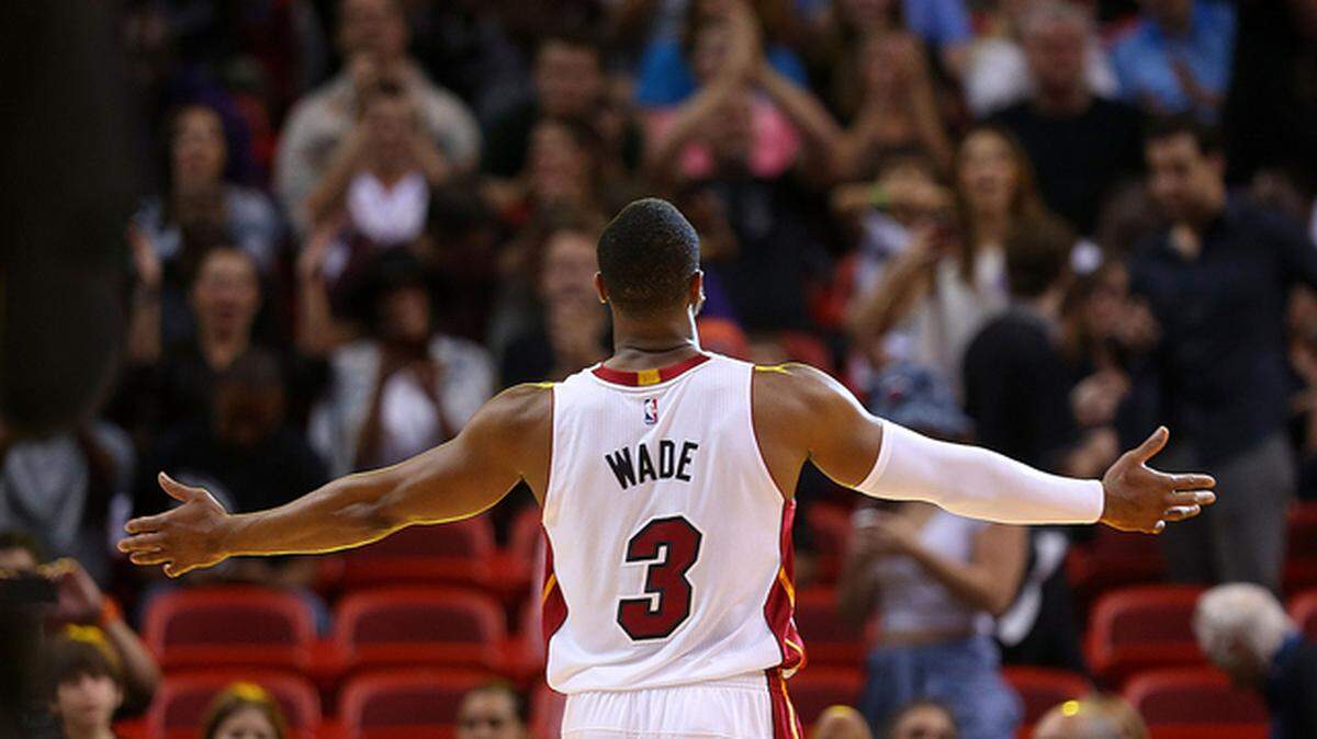 Dwyane Wade responds to the crowd during a game against the Memphis Grizzlies at American Airlines Arena in 2014.