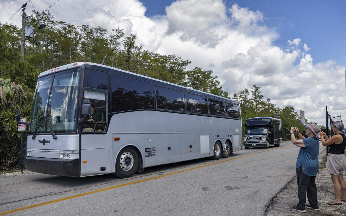 Buses carrying detained immigrants depart from Alligator Alcatraz at the Dade-Collier Training and Transition Airport on Friday, Aug. 22, 2025, in Ochopee, Fla. A federal judge has ordered the immigrant detention center to close within 60 days.