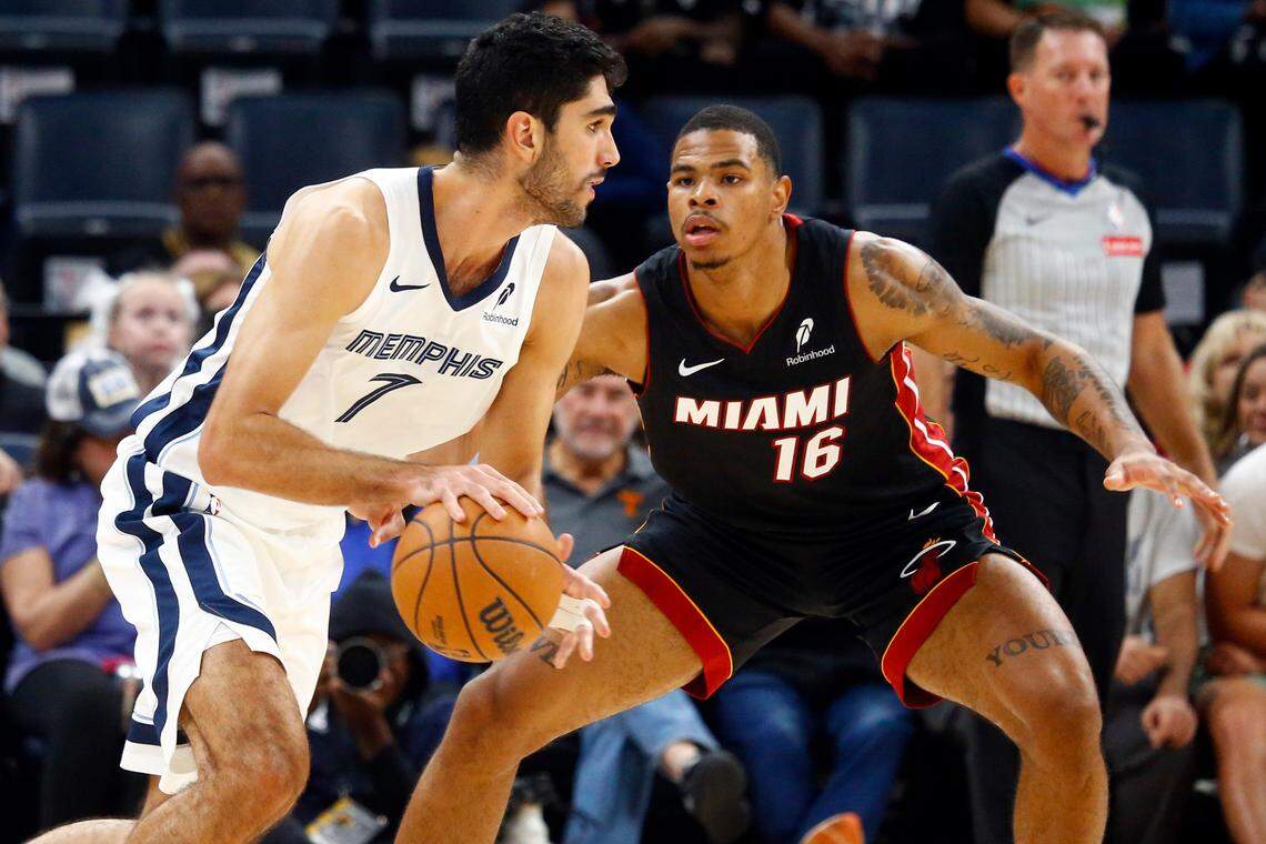 Memphis Grizzlies forward Santi Aldama (7) dribbles as Miami Heat forward Keshad Johnson (16) defends during the first half at FedExForum.