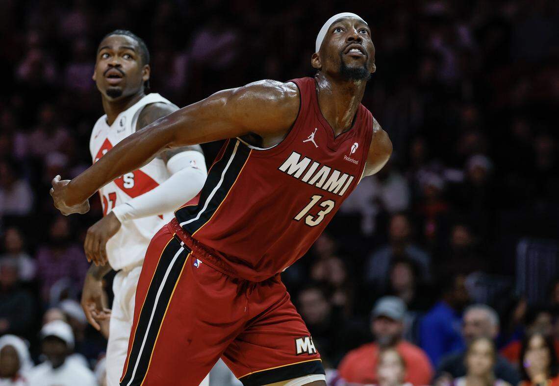 Miami Heat center Bam Adebayo (13) keeps an eye on the basket during the first half of their NBA basketball game against the Toronto Raptors at Kaseya Center in Miami on December 23, 2025.