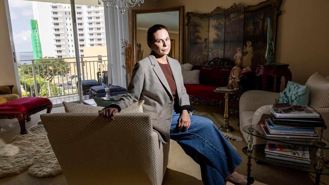 Cynthia Muniz is photographed in her condo on Brickell Key on Friday, July 18, 2025, in Miami. High special assessments and rising association fees have forced Muniz to lower the asking price of her condo by about 25%.