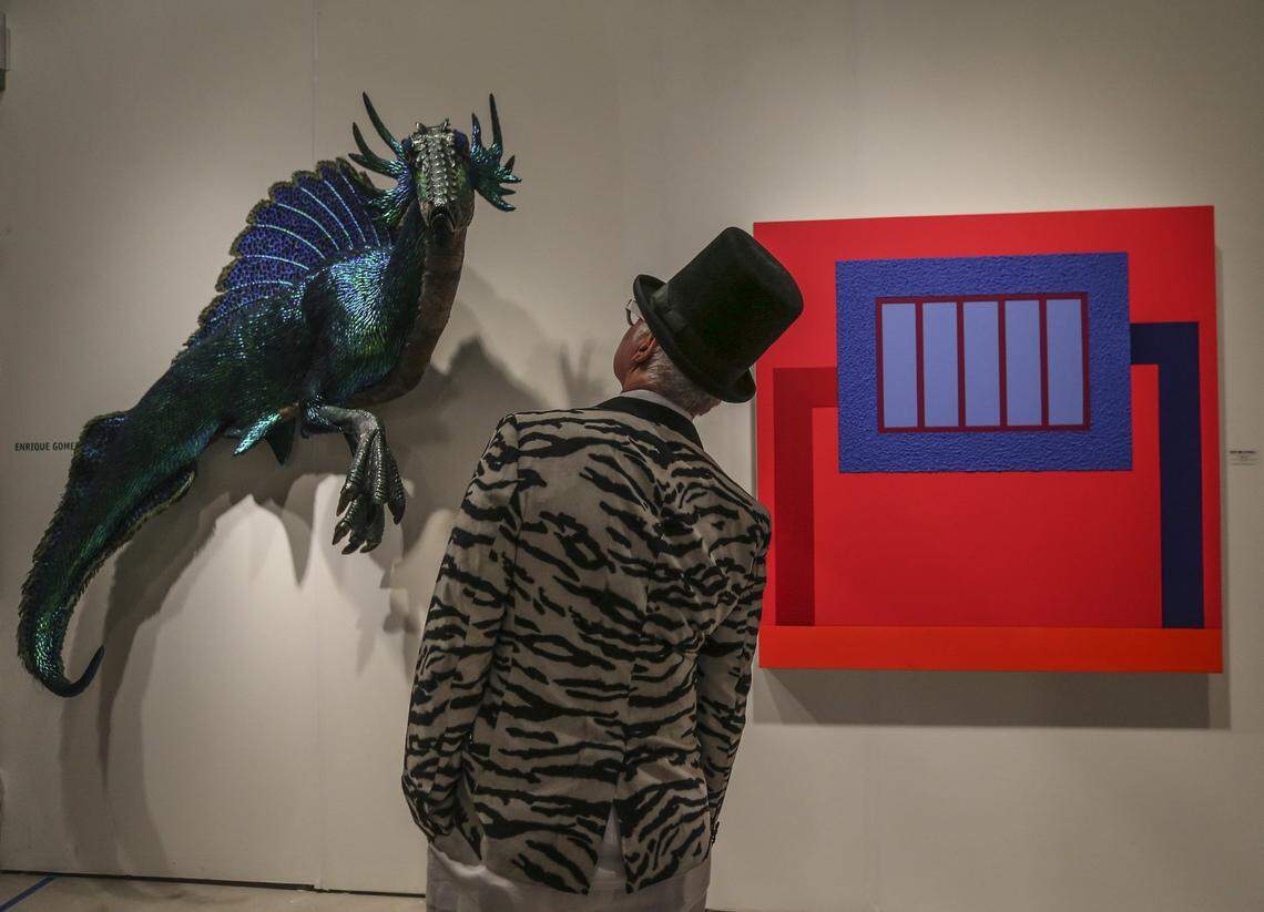 Kevin Berlin of Florence, Italy, looks at “Hippocampus” by Redland artist Enrique Gomez de Molina at the VIP opening of Art Miami and CONTEXT.