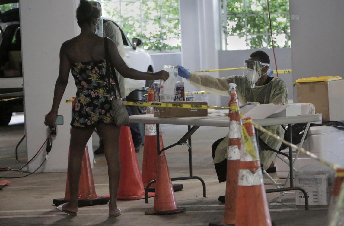 People line up at the Caleb Center garage to get tested for COVID-19 on July 17, 2020.