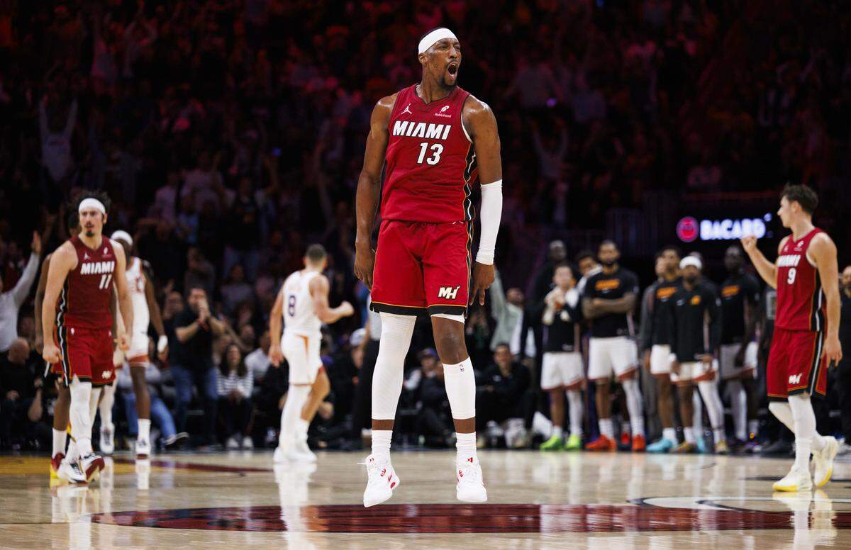 Miami Heat center Bam Adebayo (13) reacts after making a basket during the second half of a game against the Phoenix Suns on Tuesday, Jan. 13, 2026, at the Kaseya Center in downtown Miami, Fla. 