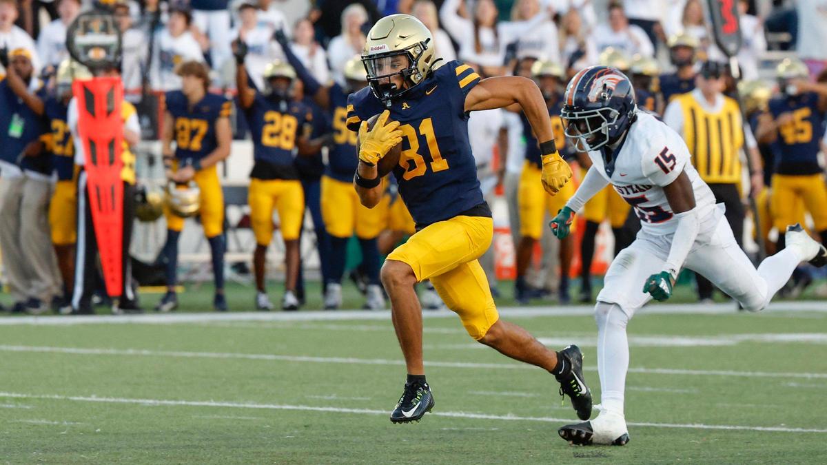 St. Thomas Aquinas wide receiver Julius Jones (81) carries the ball for the score as Homestead Broncos Semaj Smith (15) gives chase in the second half of the Class 3M state championships at Bragg Memorial Stadium in Tallahassee, Florida on Saturday, December 9, 2023.