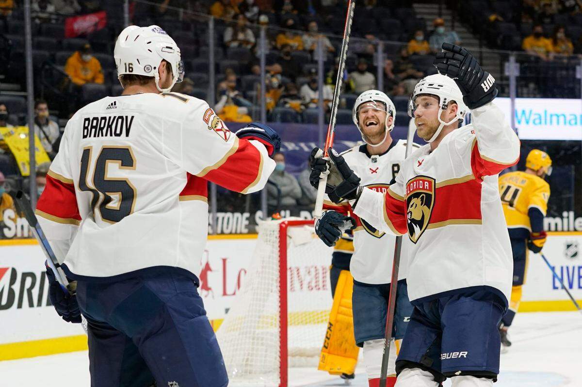 Florida Panthers center Aleksander Barkov (16) celebrates with Sam Bennett, right, after Barkov scored a goal against the Nashville Predators in the first period of an NHL hockey game Tuesday, April 27, 2021, in Nashville, Tenn. (AP Photo/Mark Humphrey)