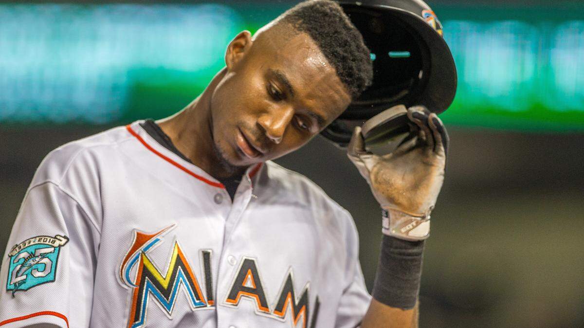 Miami Marlins center fielder Lewis Brinson (9) reacts to missing with a ground ball to second during the seventh inning of the game against Arizona Diamondbacks at Marlins Park in Miami, Wednesday, June 27, 2018.