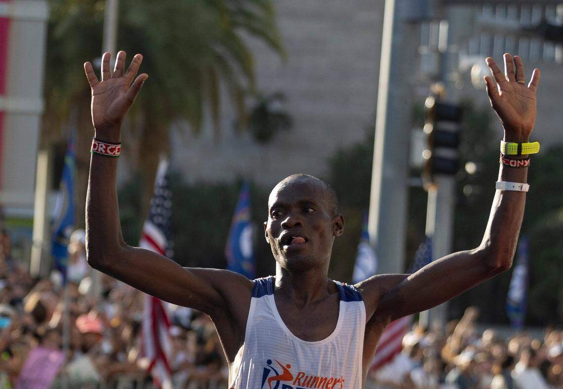 George Onyancha, 28, crosses the line as the first person to finish the full marathon during the Life Time Miami Marathon and Half on Sunday, Jan. 28, 2024, finishing at Bayfront Park in downtown Miami.