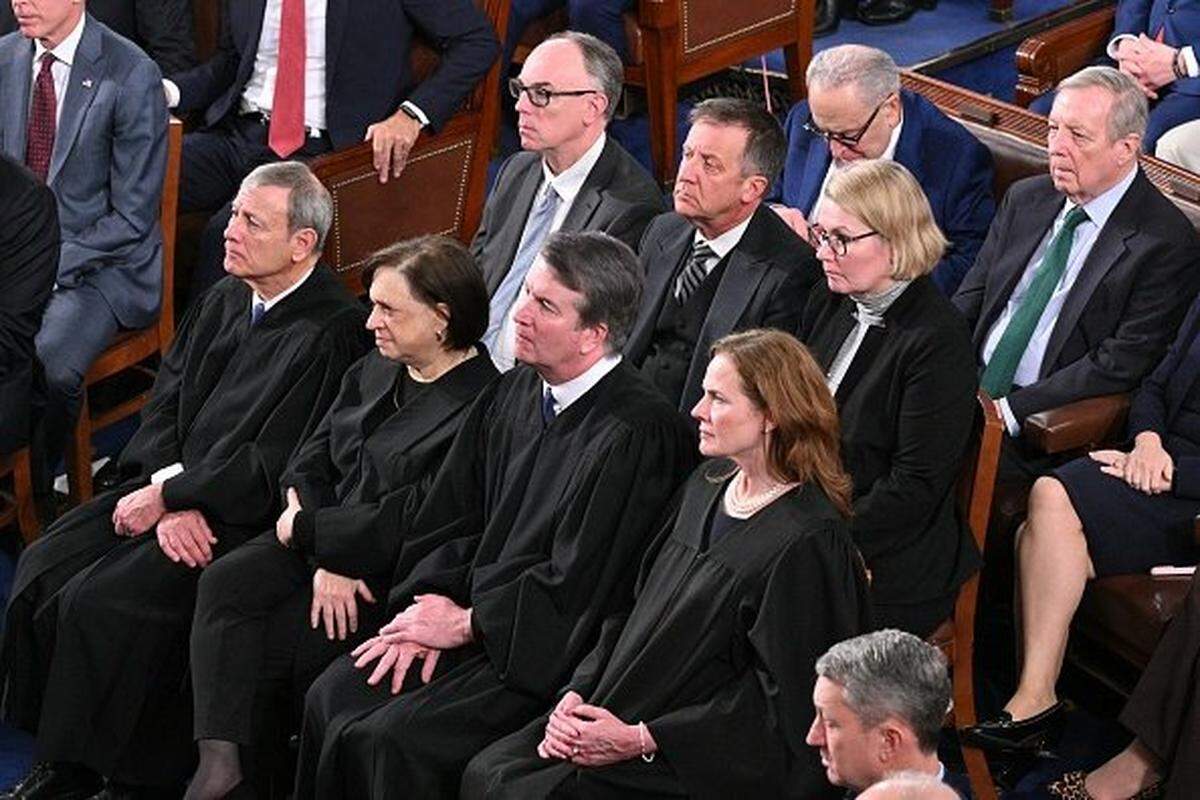 (Front row, L/R) Supreme Court Chief Justice John Roberts, Supreme Court Justice Elena Kagan, Supreme Court Justice Brett Kavanaugh, and Supreme Court Justice Amy Coney Barrett listen as US President Donald Trump delivers the State of the Union address in the House Chamber of the US Capitol in Washington, DC, on February 24, 2026. (Photo by Mandel NGAN / AFP via Getty Images)